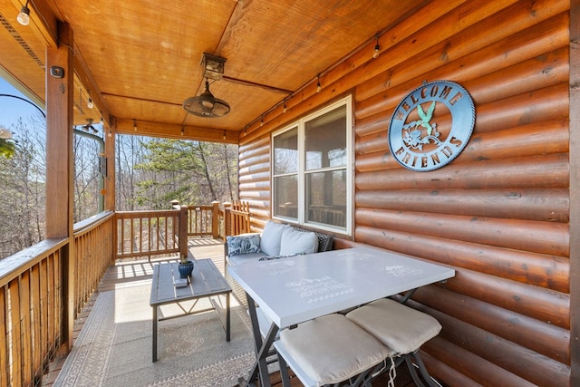 wooden deck featuring outdoor lounge area