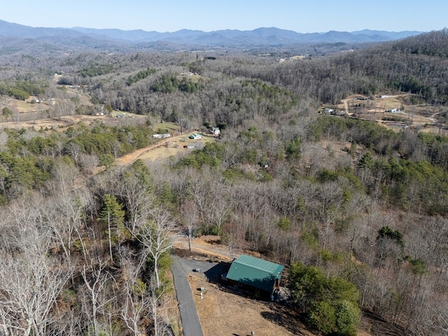 aerial view with a mountain view and a forest view