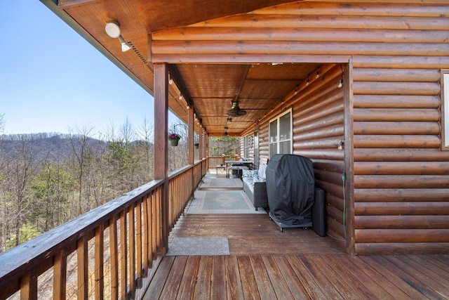 deck featuring a view of trees