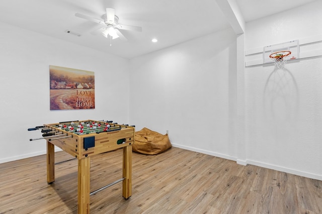 playroom with light wood-type flooring and ceiling fan