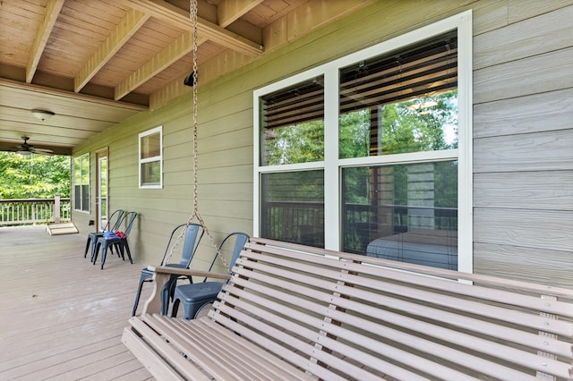 wooden terrace featuring ceiling fan