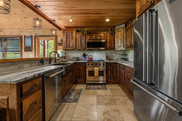 kitchen with dark stone counters, wood ceiling, hanging light fixtures, sink, and high quality appliances