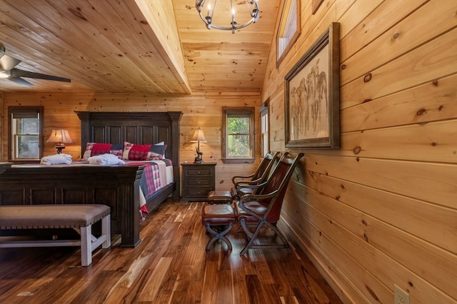 bedroom with dark wood-type flooring, wooden ceiling, wood walls, and vaulted ceiling