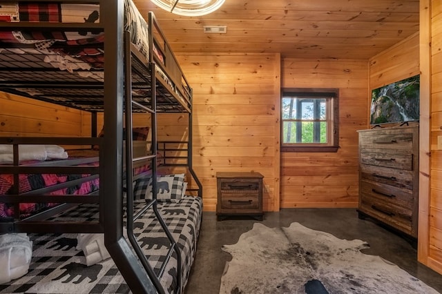 bedroom featuring wood walls and wooden ceiling