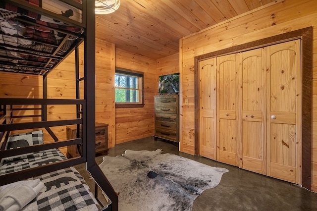 bedroom featuring wooden walls