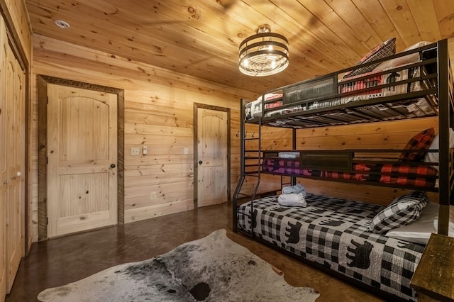 bedroom with wood walls and wooden ceiling