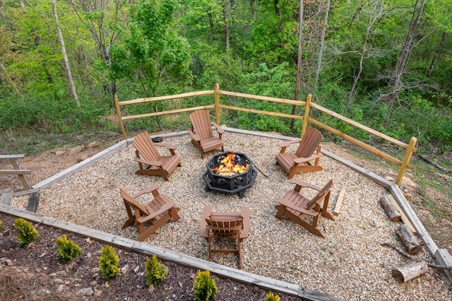 view of yard with a fire pit