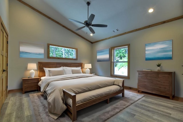 bedroom featuring ornamental molding, light hardwood / wood-style flooring, high vaulted ceiling, and ceiling fan