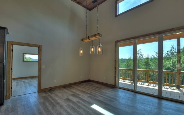 interior space featuring high vaulted ceiling and hardwood / wood-style floors