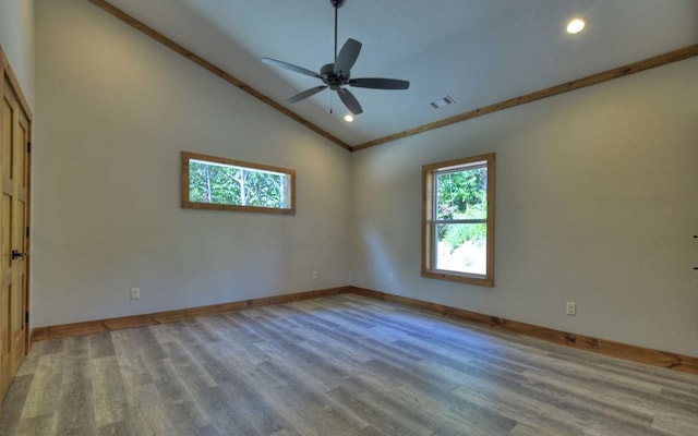 empty room with crown molding, light wood-type flooring, and ceiling fan