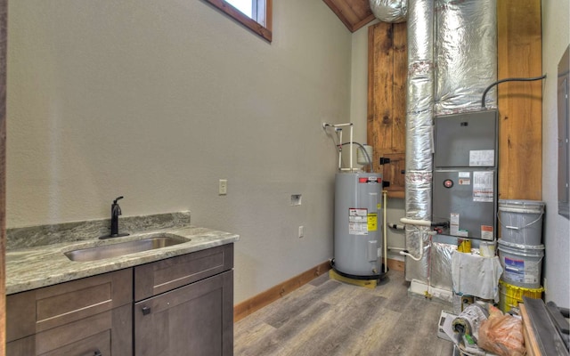 utility room with sink and water heater