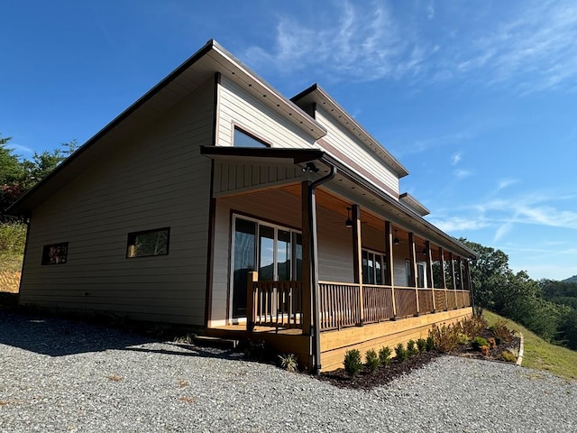 view of side of property featuring a porch