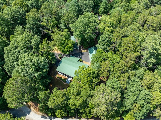 drone / aerial view featuring a forest view