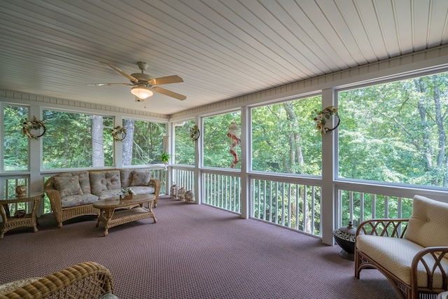 sunroom with ceiling fan and a wealth of natural light