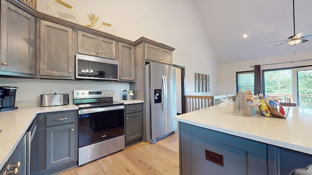 162 Barefoot Trl, Blairsville, GA 30512 - kitchen featuring appliances with stainless steel finishes, high vaulted ceiling, a ceiling fan, light countertops, and light wood finished floors