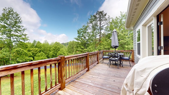 162 Barefoot Trl, Blairsville, GA 30512 - wooden deck featuring outdoor dining area, area for grilling, and a lawn