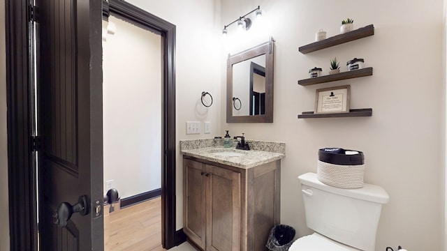 162 Barefoot Trl, Blairsville, GA 30512 - half bathroom with toilet, wood finished floors, and vanity