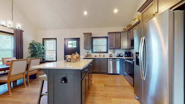 162 Barefoot Trl, Blairsville, GA 30512 - kitchen with appliances with stainless steel finishes, a sink, light countertops, a kitchen island, and light wood-style floors