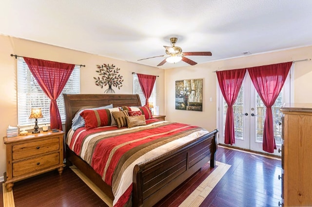bedroom featuring a ceiling fan, access to outside, french doors, and dark wood finished floors