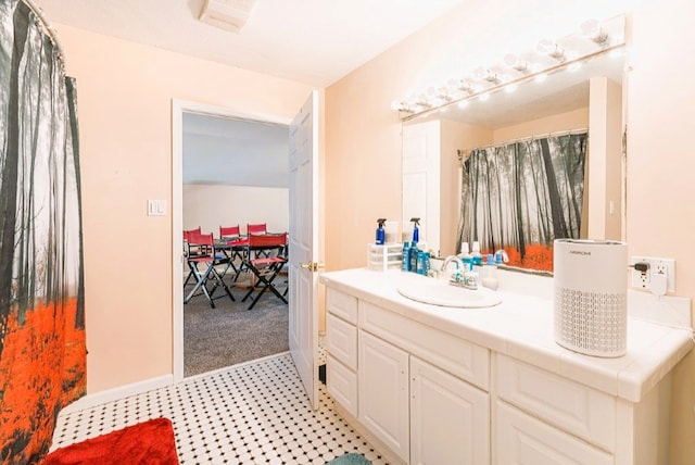 bathroom featuring tile patterned floors and vanity