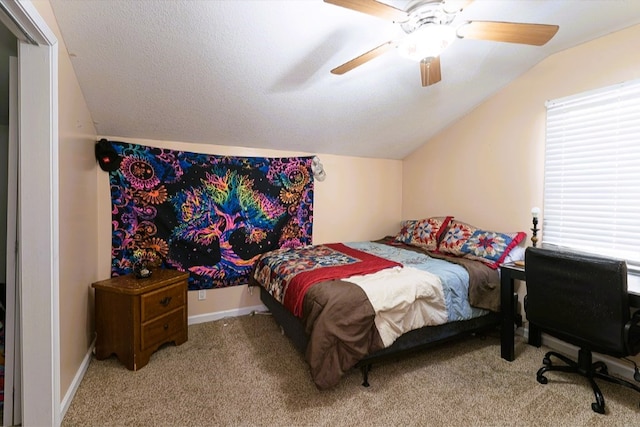 carpeted bedroom with ceiling fan and lofted ceiling