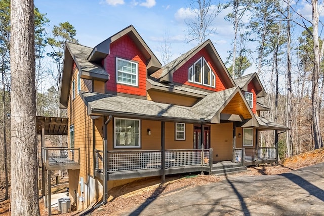 view of front of house featuring a porch and a shingled roof