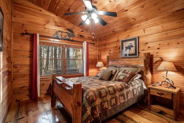 bedroom featuring wood ceiling, vaulted ceiling, wood walls, and wood-type flooring