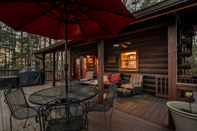 wooden terrace featuring ceiling fan, an outdoor living space, grilling area, and outdoor dining space