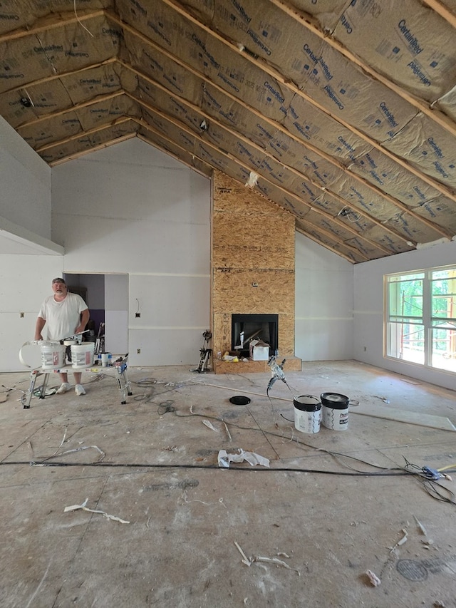 31 Small St, Blairsville, GA 30512 - unfurnished living room featuring vaulted ceiling and a large fireplace