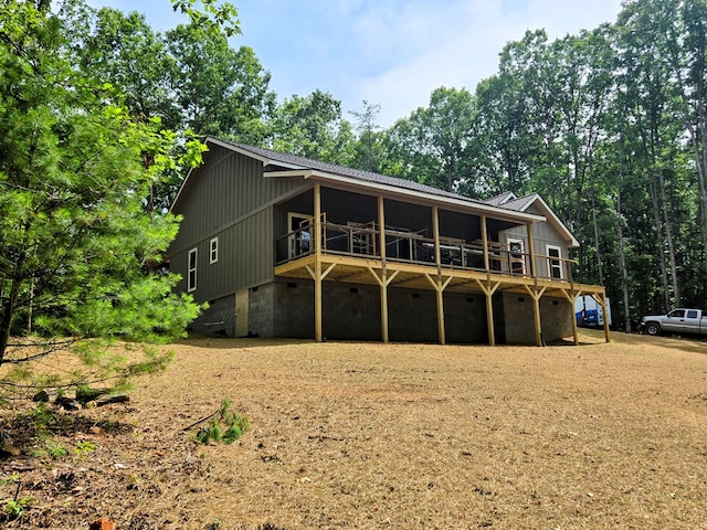31 Small St, Blairsville, GA 30512 - view of front facade with a wooden deck and board and batten siding