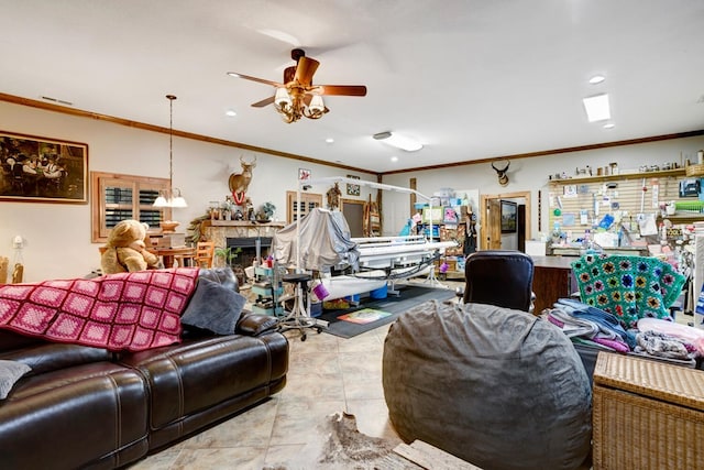 living room with a ceiling fan, recessed lighting, ornamental molding, and tile patterned flooring
