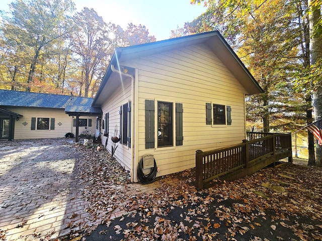 view of side of property featuring a deck