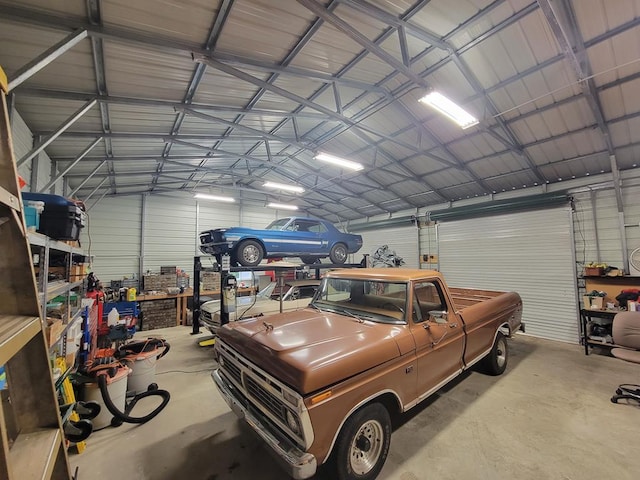 garage with a workshop area and metal wall