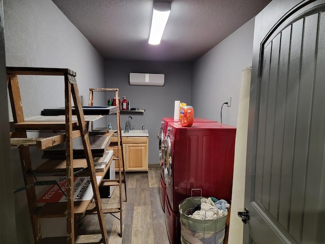 storage featuring separate washer and dryer and a sink