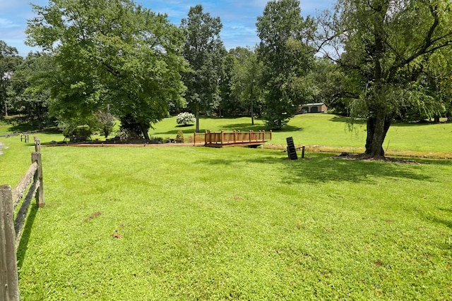 view of property's community featuring a lawn