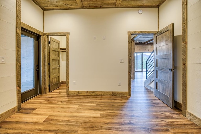 empty room with hardwood / wood-style flooring