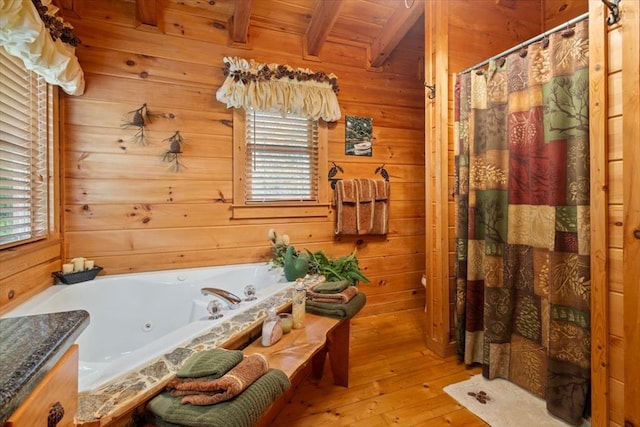 bathroom featuring wood walls, hardwood / wood-style floors, wood ceiling, and beamed ceiling