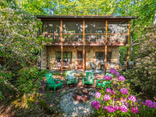 90 Holloway Cir, Blue Ridge, GA 30513 - view of outbuilding with an outdoor fire pit and a sunroom