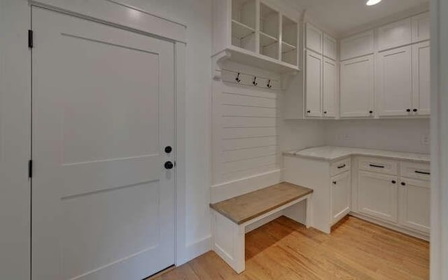 mudroom with light hardwood / wood-style flooring