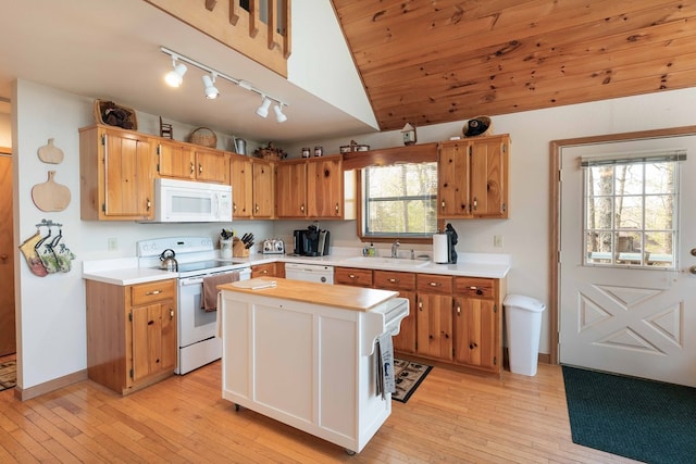 1595 Country Walk, Murphy, NC 28906 - kitchen with white appliances, a sink, track lighting, vaulted ceiling, and light wood-style flooring