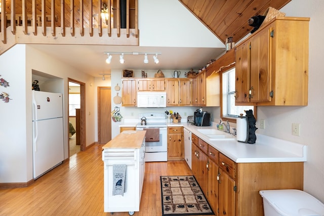 1595 Country Walk, Murphy, NC 28906 - kitchen with white appliances, a sink, light wood-style flooring, a kitchen island, and vaulted ceiling