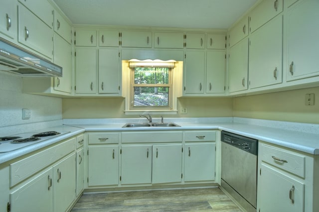 kitchen featuring light countertops, a sink, light wood-type flooring, dishwasher, and under cabinet range hood