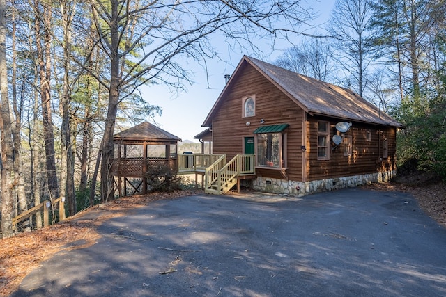 view of front of home with a gazebo, crawl space, and driveway