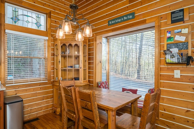 dining space featuring hardwood / wood-style floors