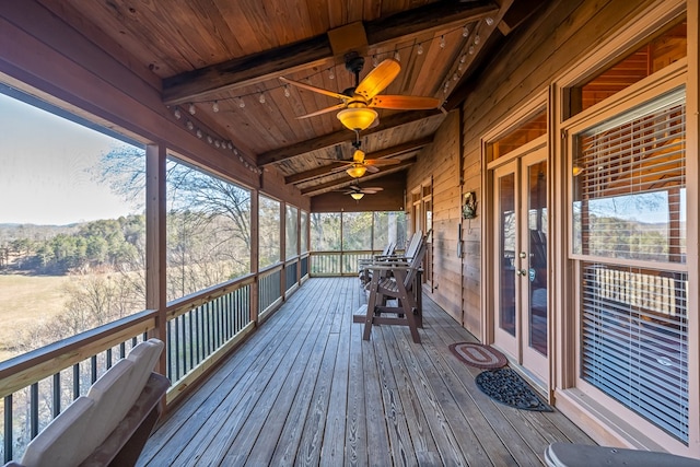 wooden terrace featuring ceiling fan