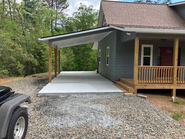 view of side of property featuring covered porch