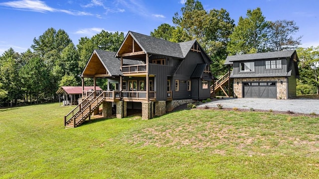 view of front facade with a garage, a front yard, and a deck