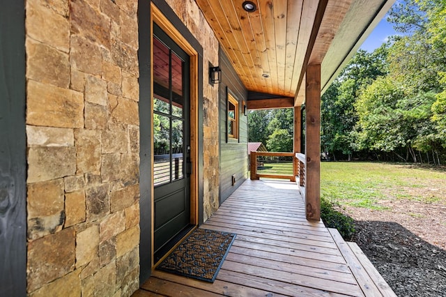 exterior space featuring a lawn and covered porch