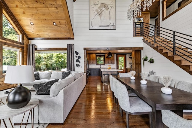 living room with high vaulted ceiling, wood walls, wood ceiling, and dark hardwood / wood-style floors