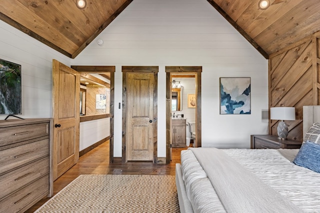 bedroom with dark hardwood / wood-style flooring, connected bathroom, wood ceiling, and vaulted ceiling